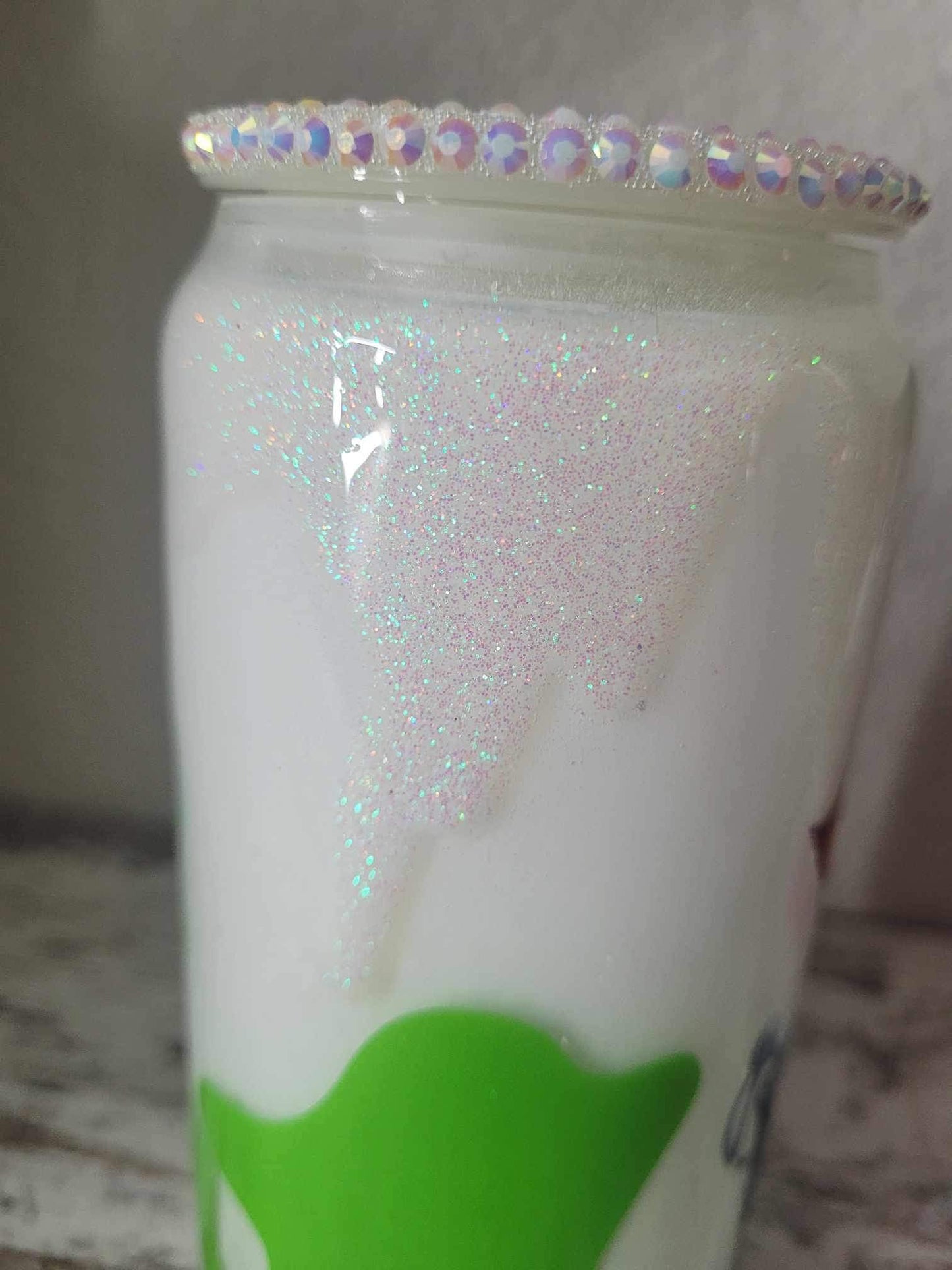 Baby Cow in a Dairy Pail.  16oz Glass Tumbler with Rhinestone Lid.  Also has iridescent drips all around the tumbler.